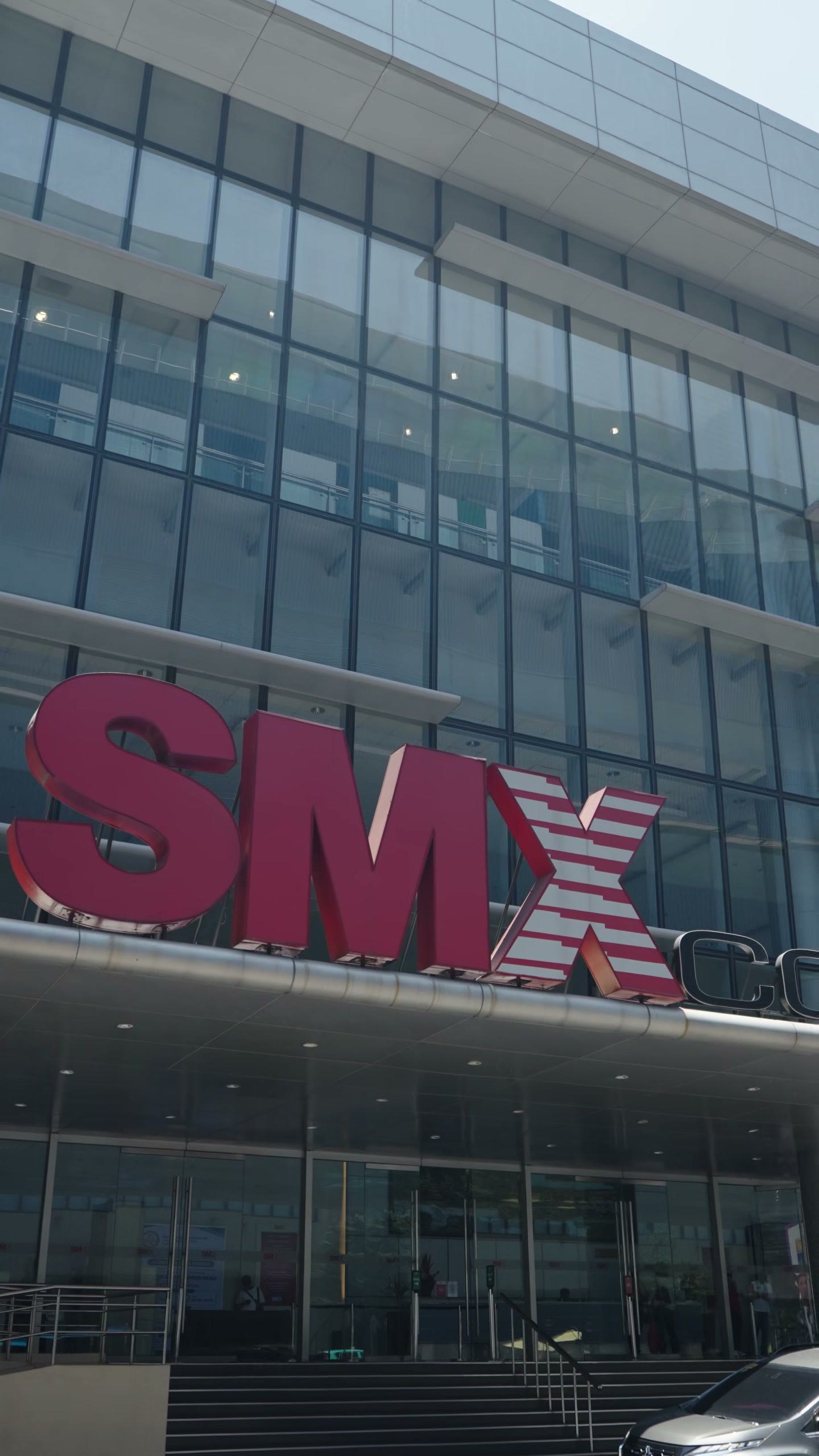 The SMX Convention Center facade on the opening day