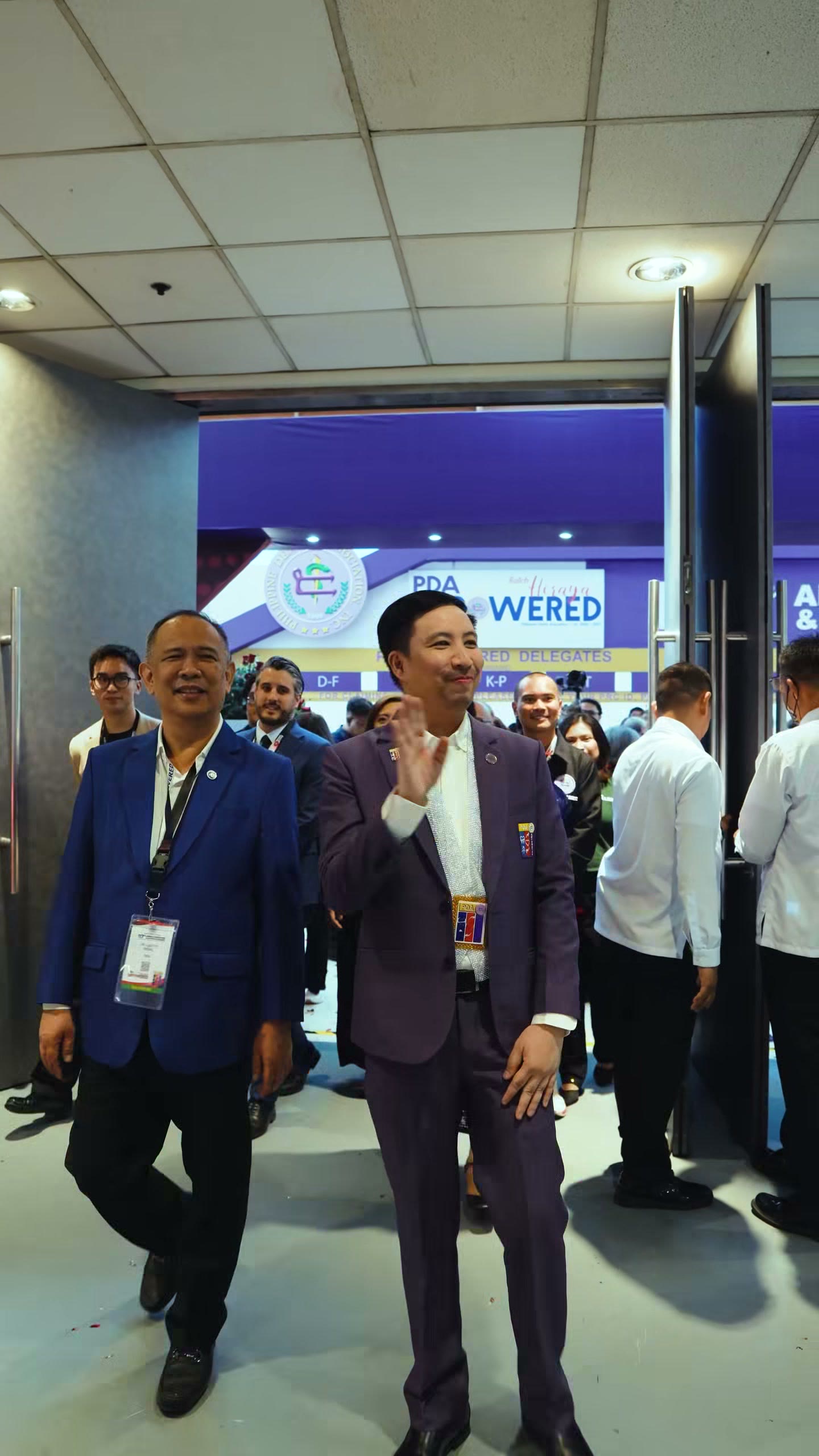 PDA officers walking the exhibition hall in blazers