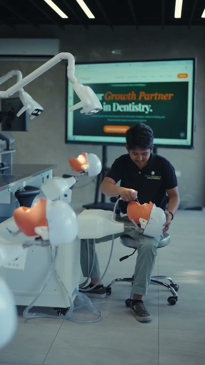 A trainee working at a phantom head station