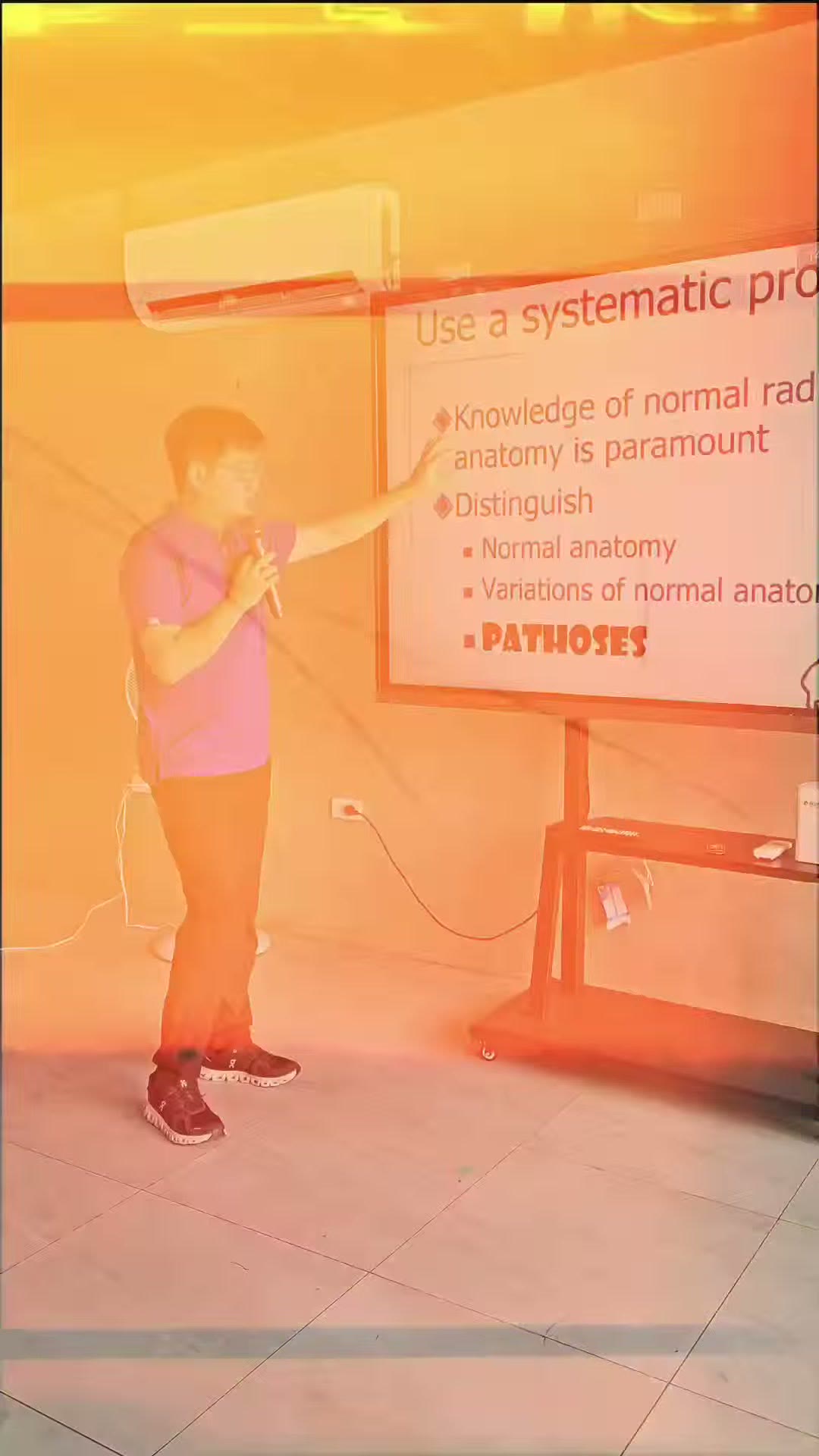 Dr. Pocholo Loleng at the slide on systematic radiographic reading