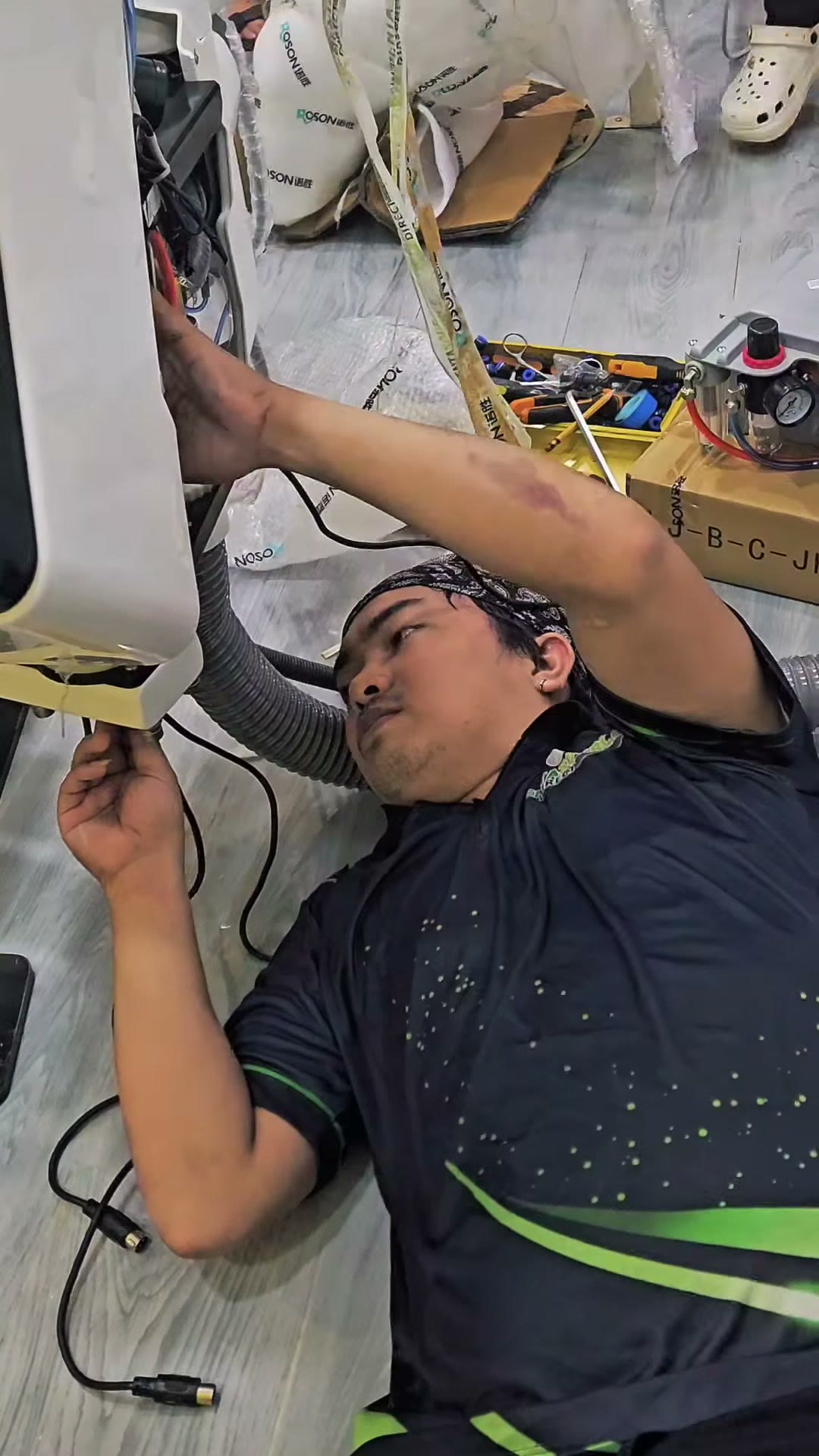 Our technician working under the light arm during assembly