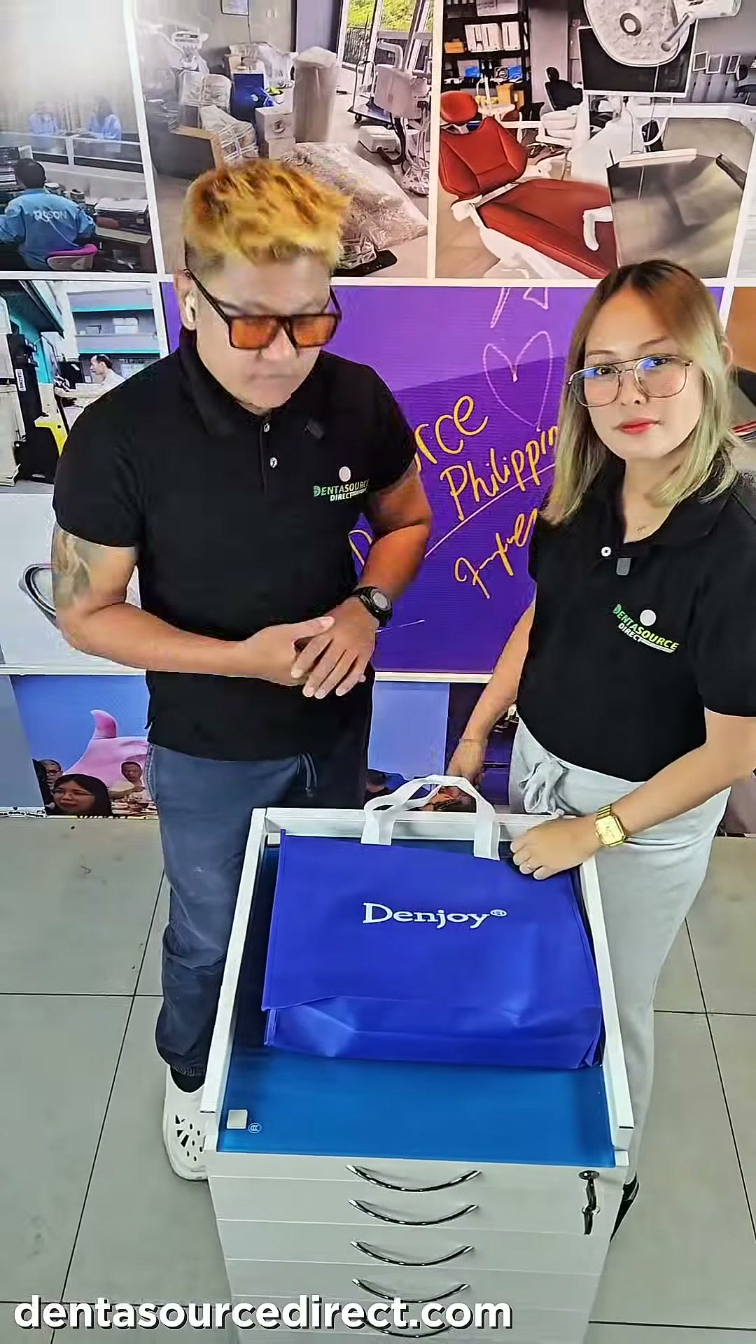 Two of our team at the showroom counter with the first Denjoy bag