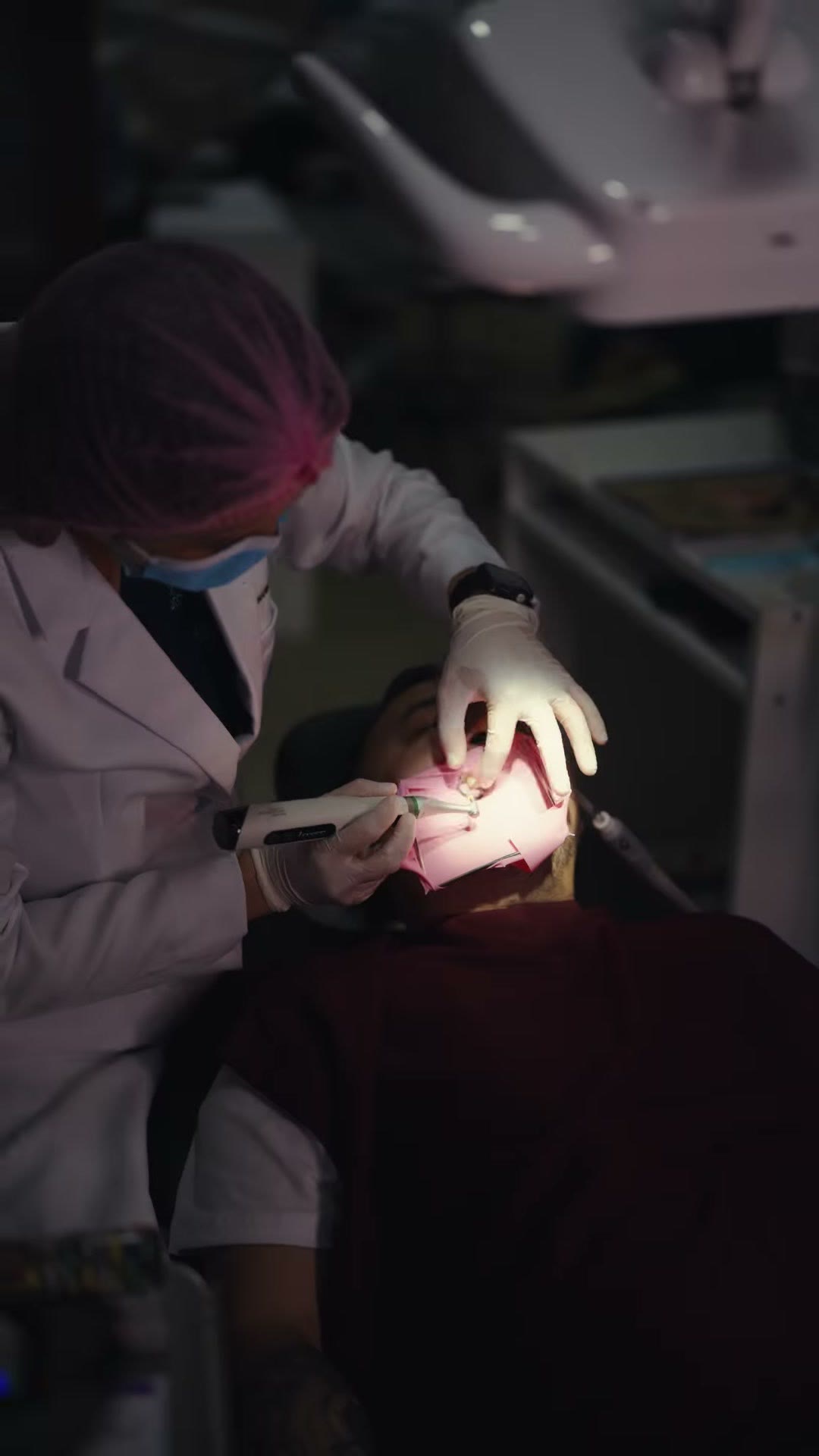 Working inside the mouth during a root canal procedure