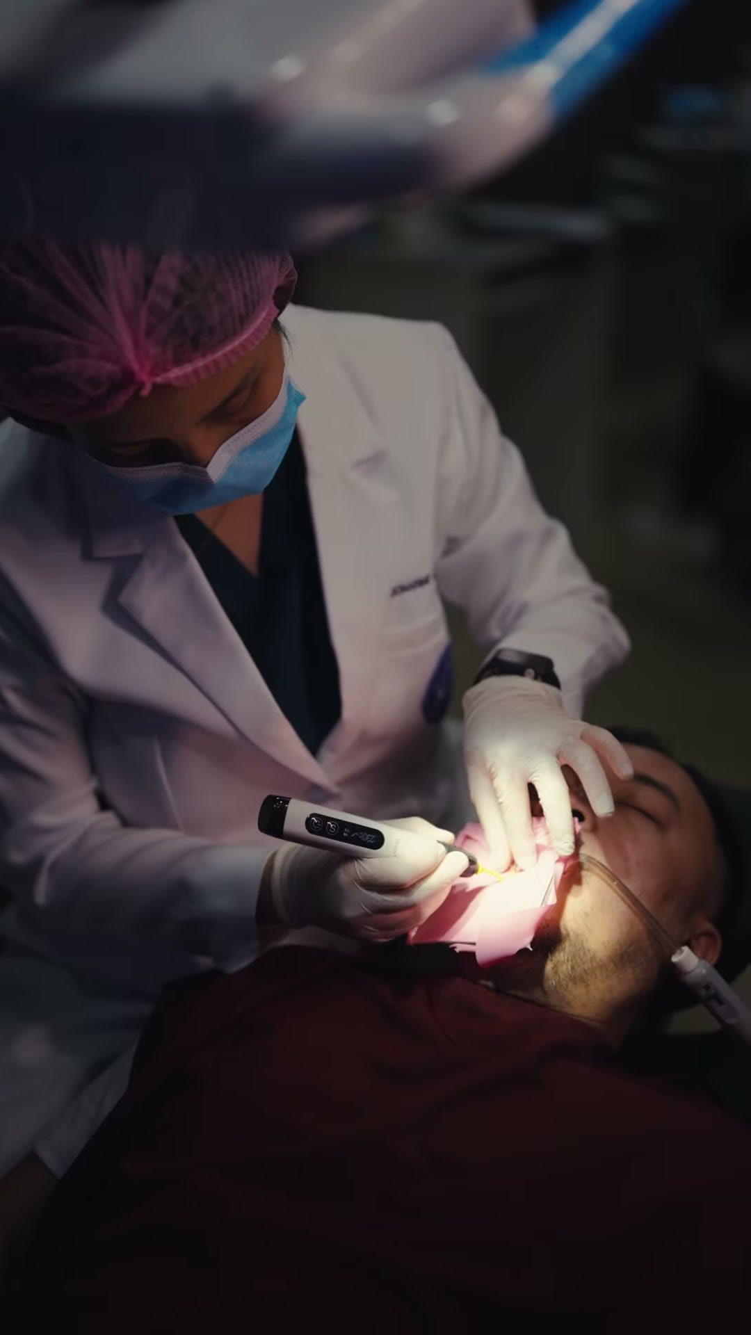The endodontic motor at the patient's mouth