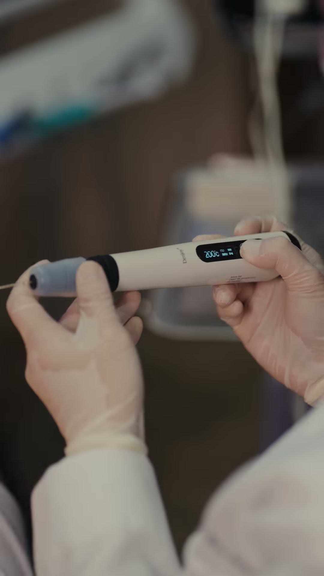 Holding the endo motor with its readout visible
