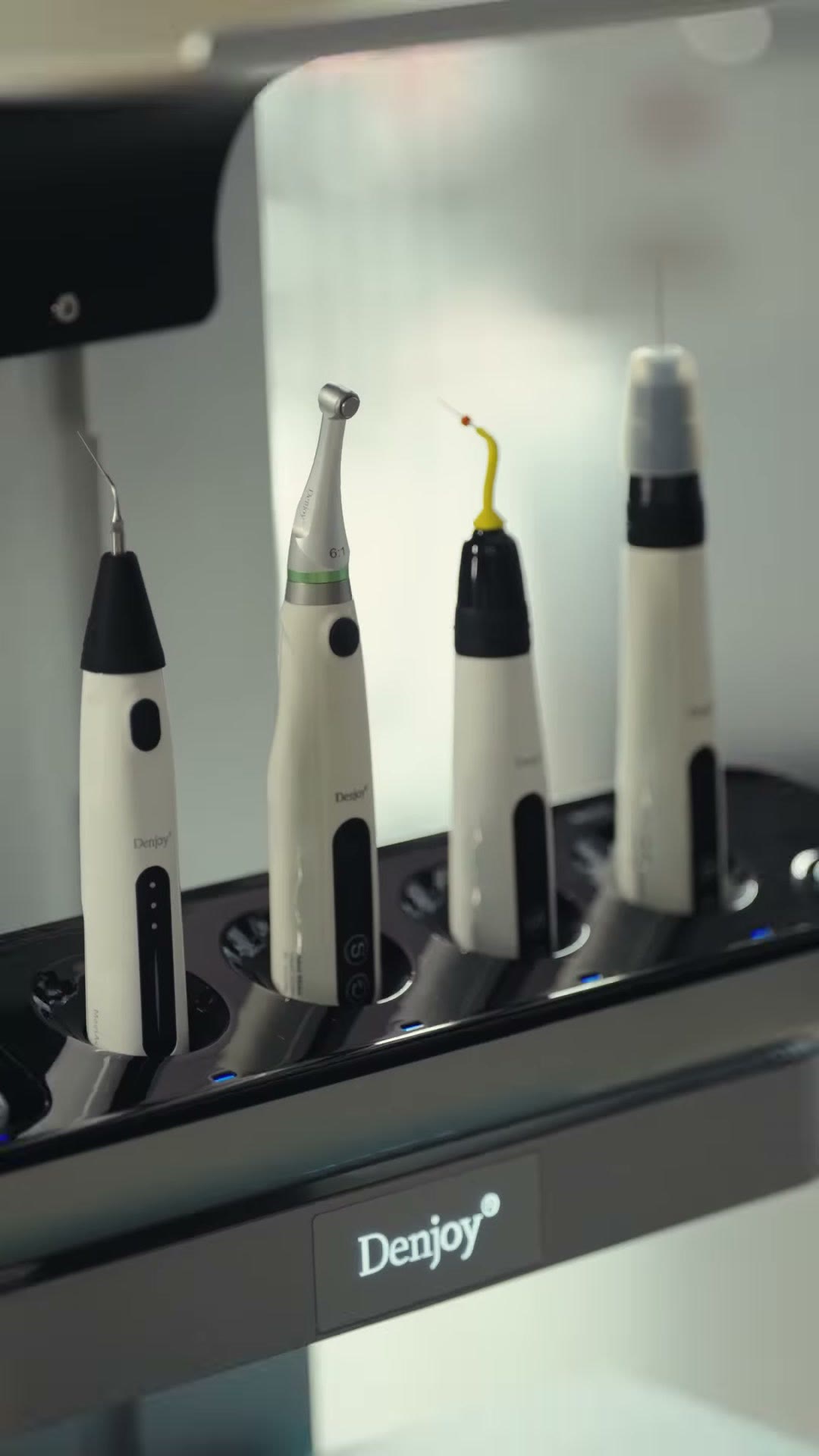 Denjoy endodontic devices seated in the charging dock