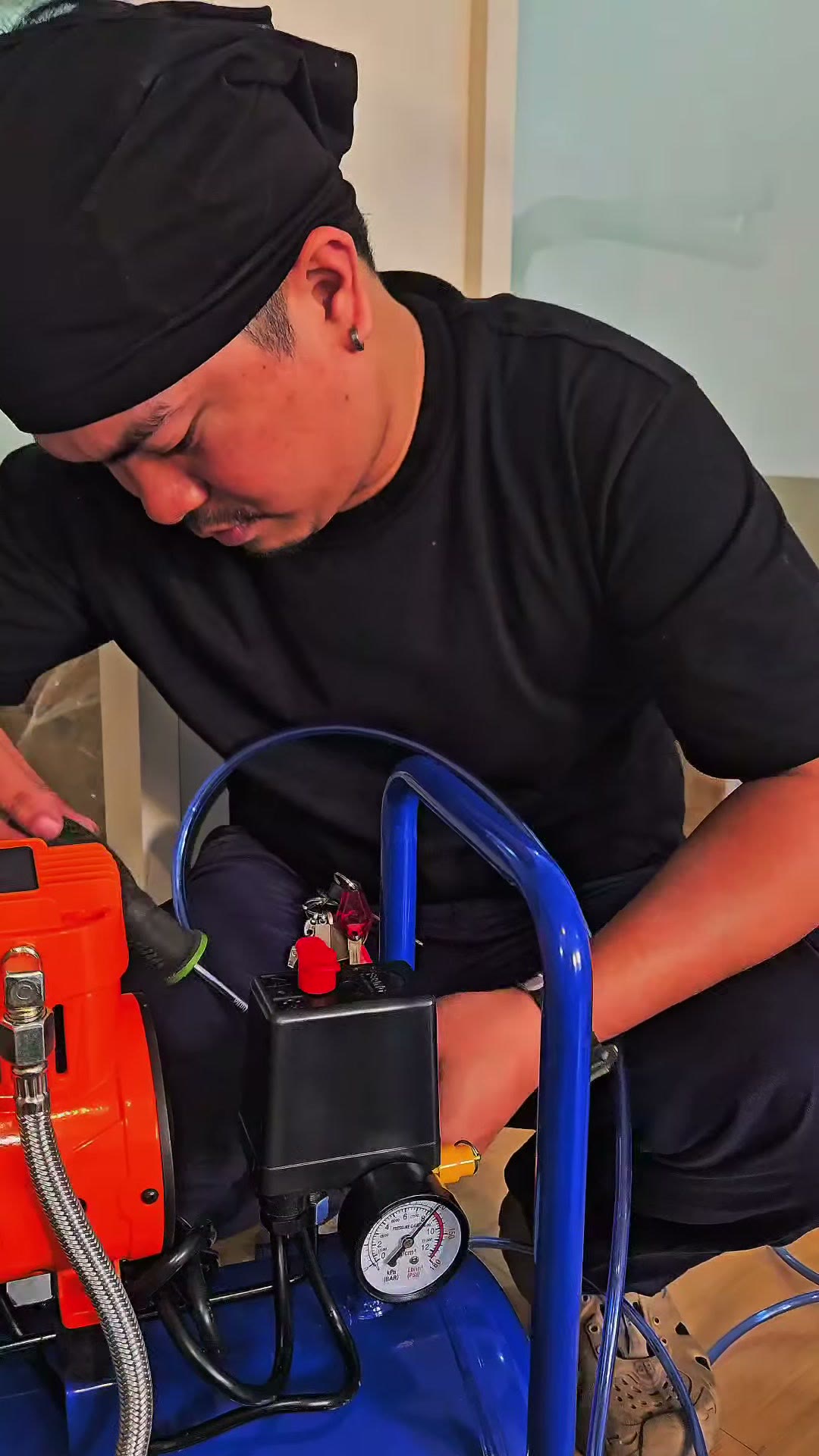 Setting up the compressor that feeds the handpieces and syringe