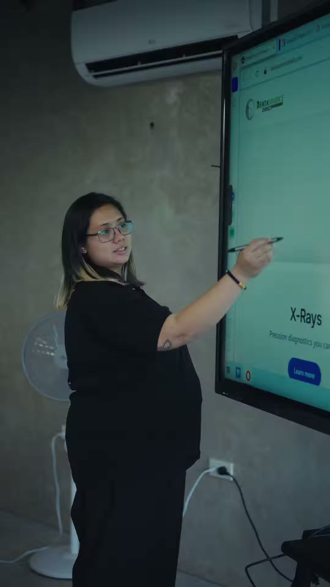Instructor annotating a radiograph lesson on the interactive board