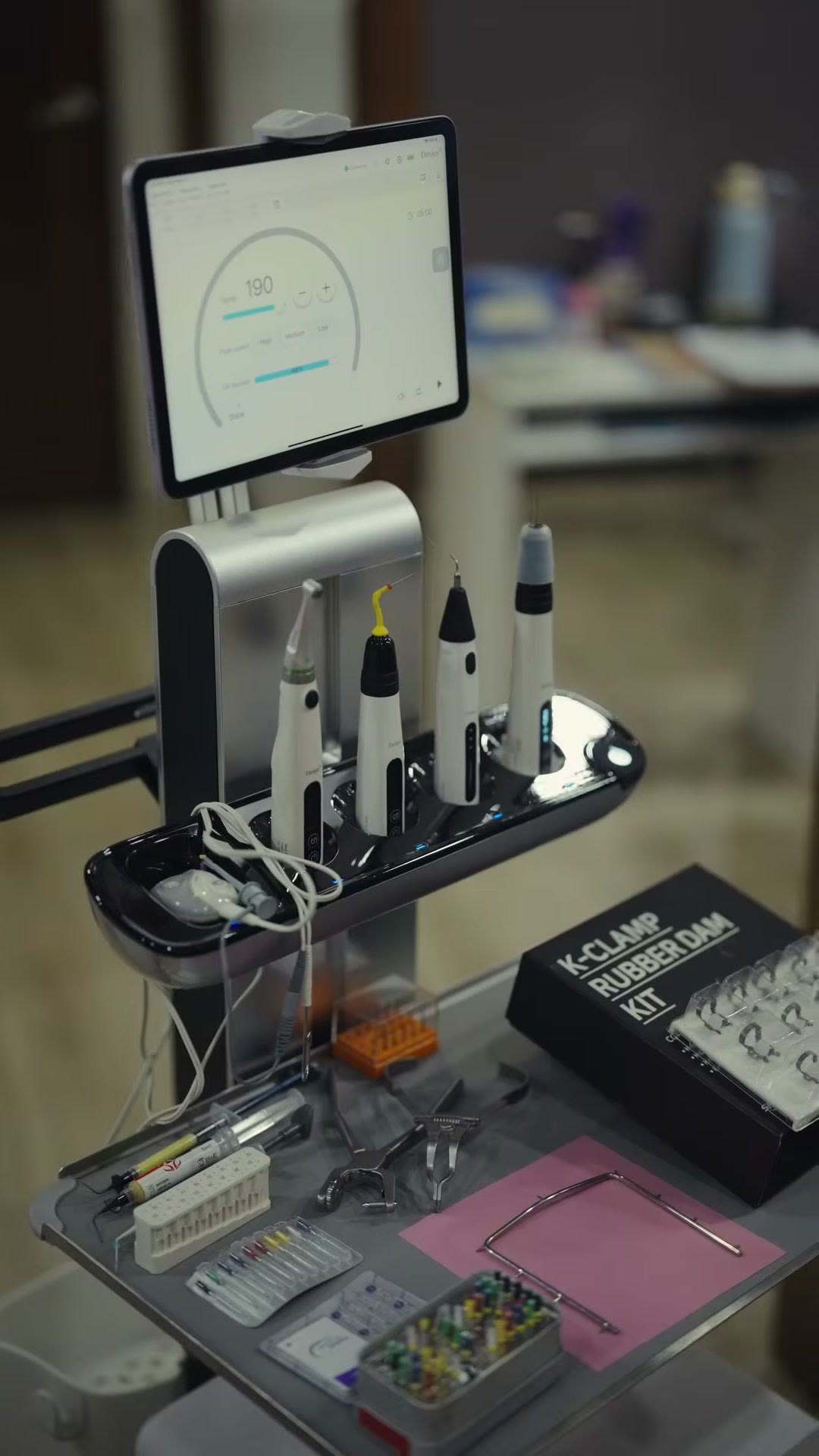 The cart holding the devices and a rubber dam kit