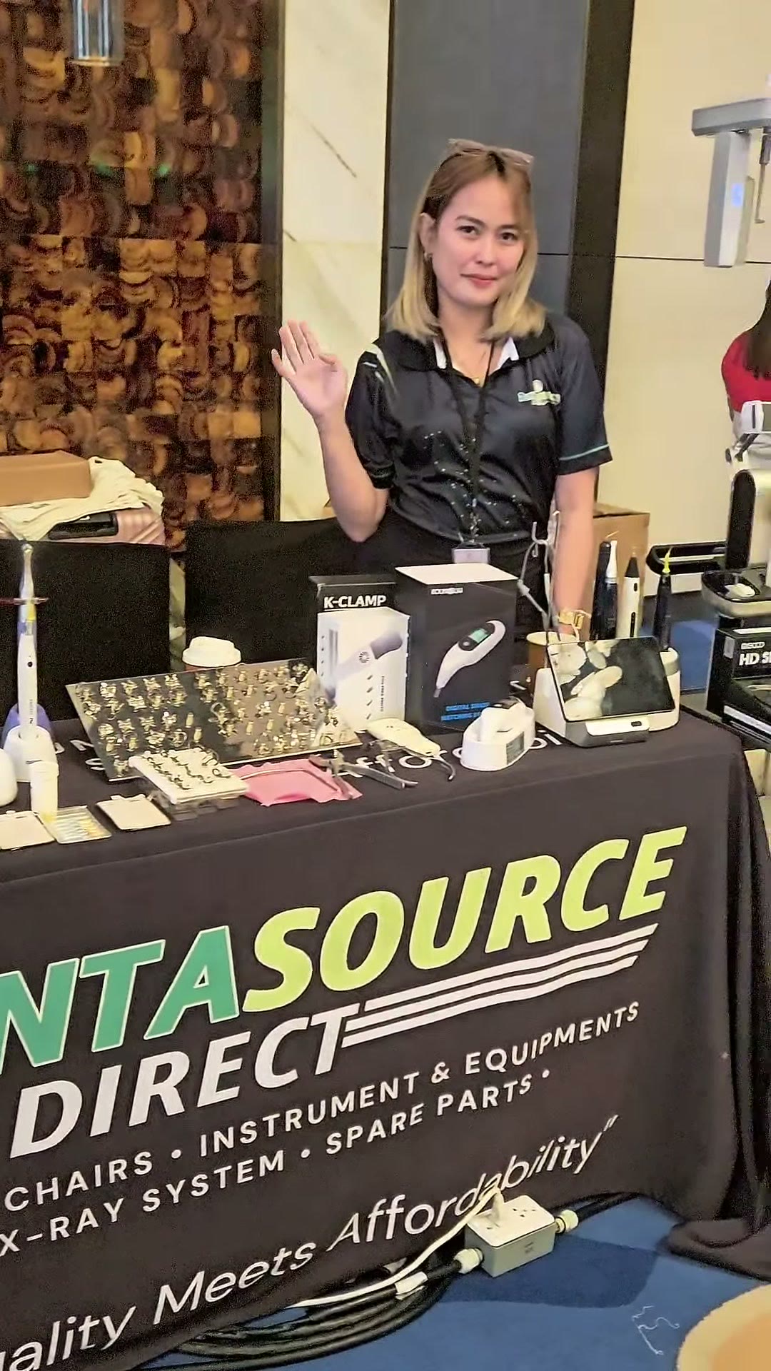 A member of our team greeting arrivals at the DIGICON table