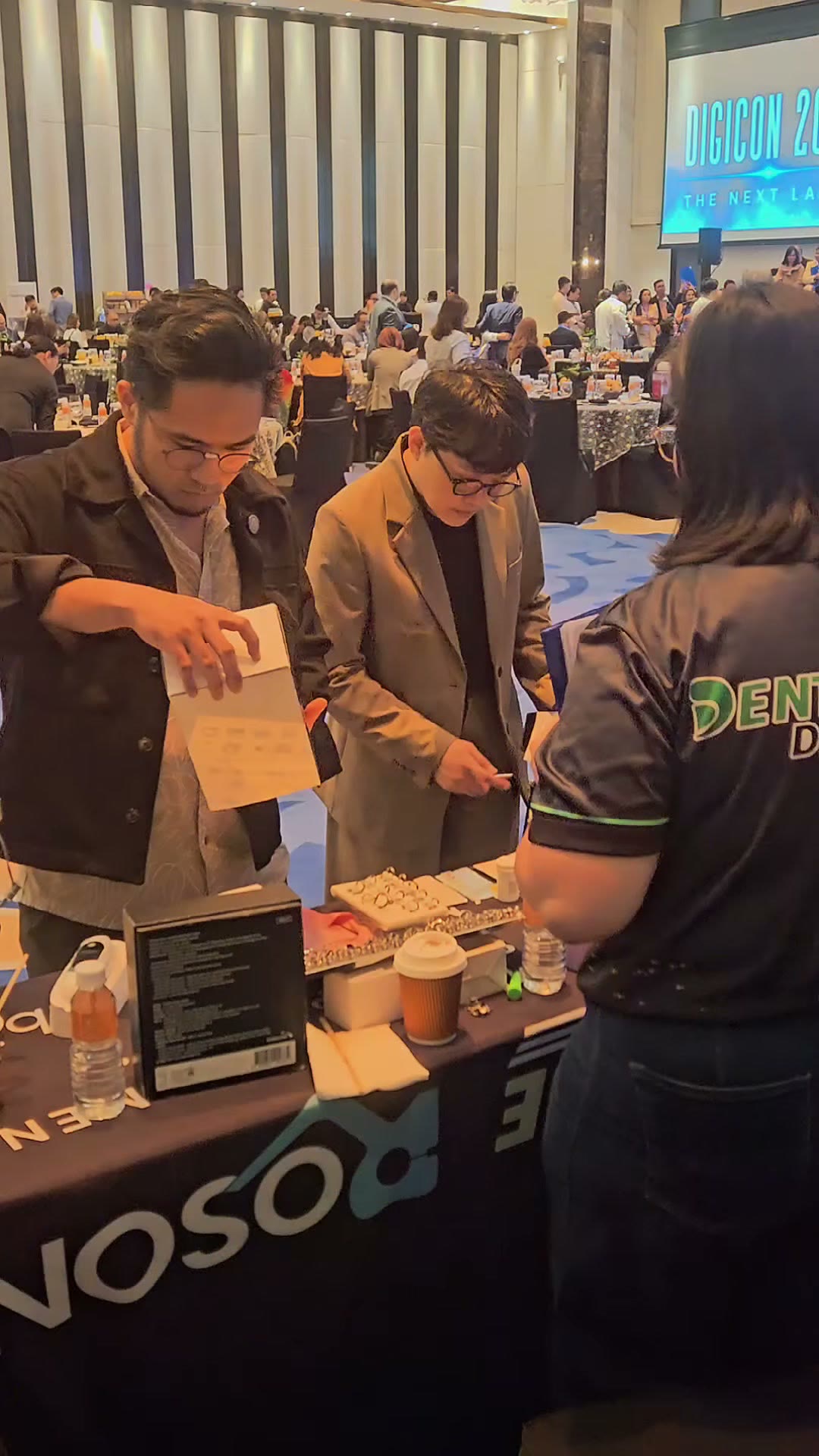 Dentists going through devices with our team at the ROSON draped table