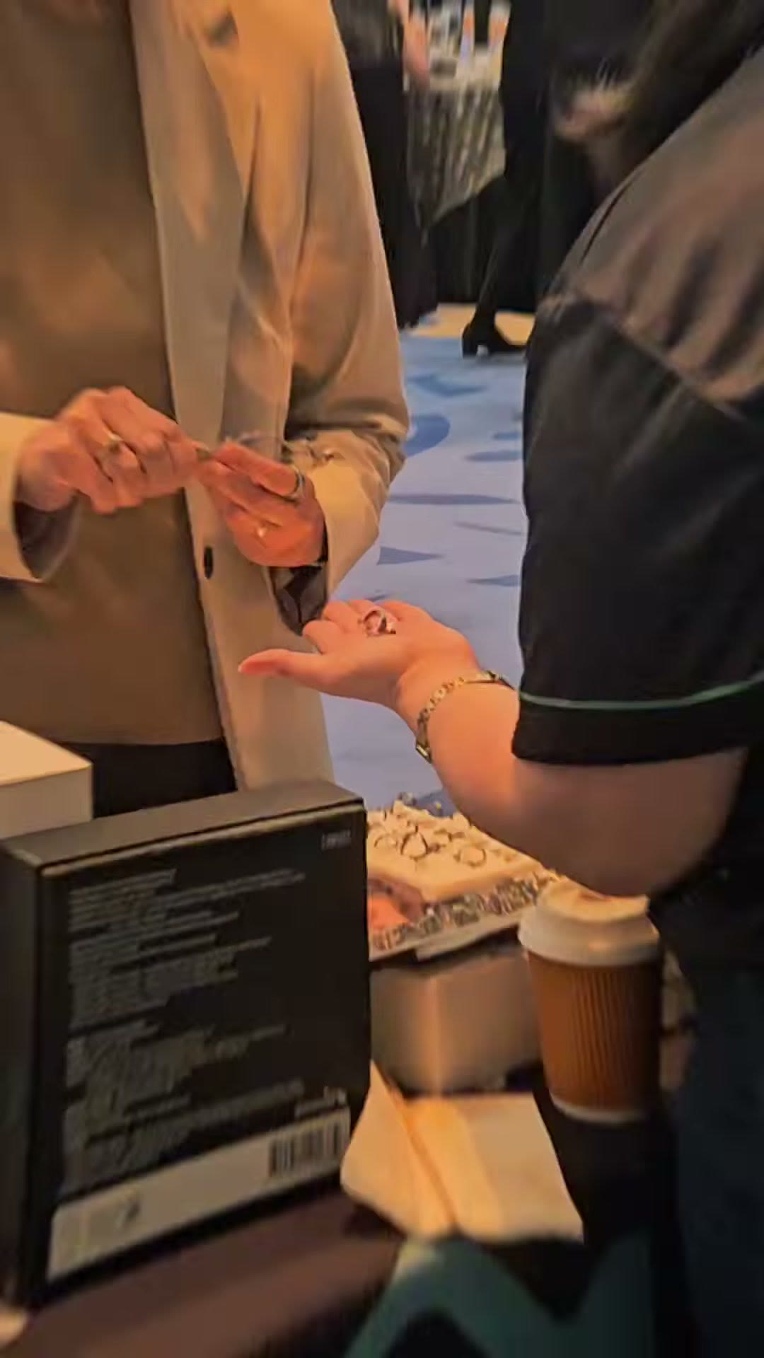 A visitor examining a product at close range