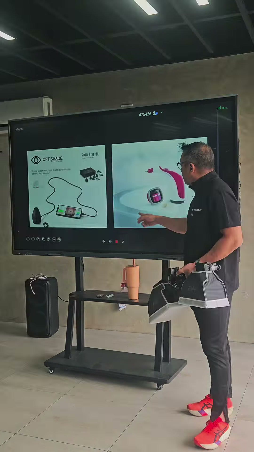 The instructor at the interactive screen with the shade matching slide
