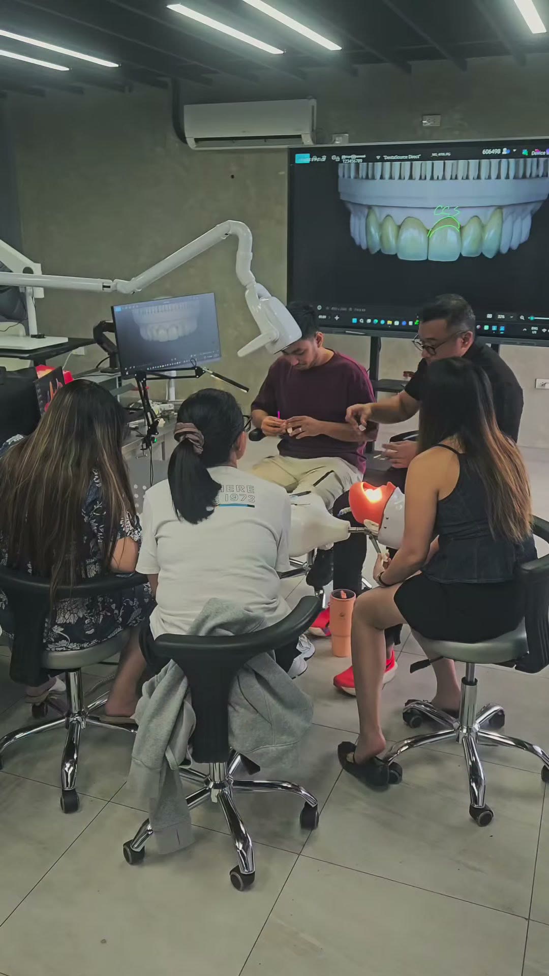 The group at the screen reviewing a digital smile design