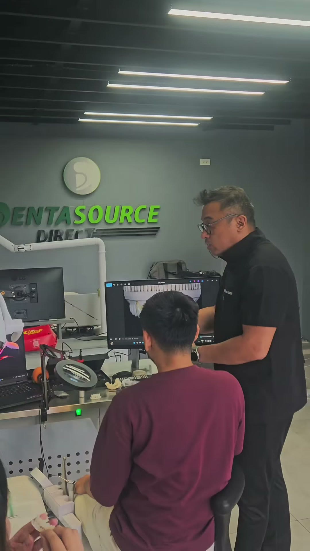 The instructor at the monitor during the case review