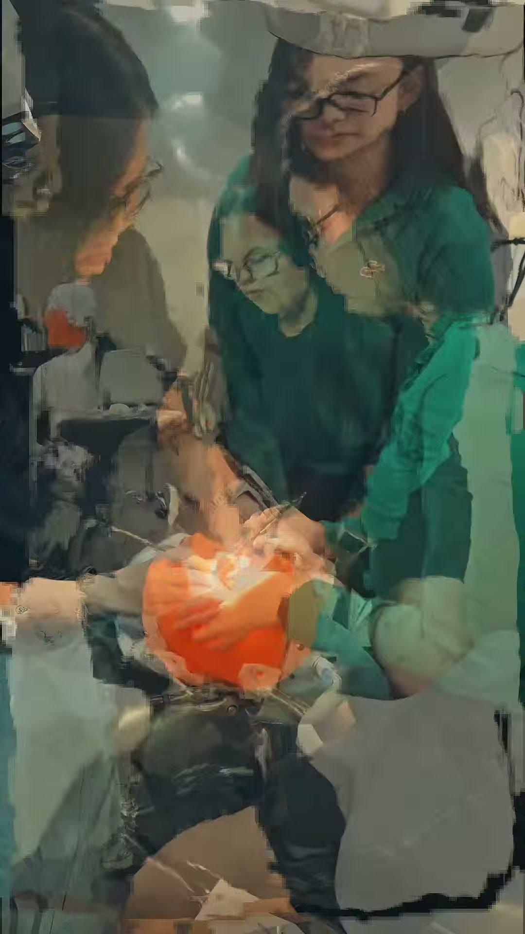 Trainees practising the procedure on the phantom head