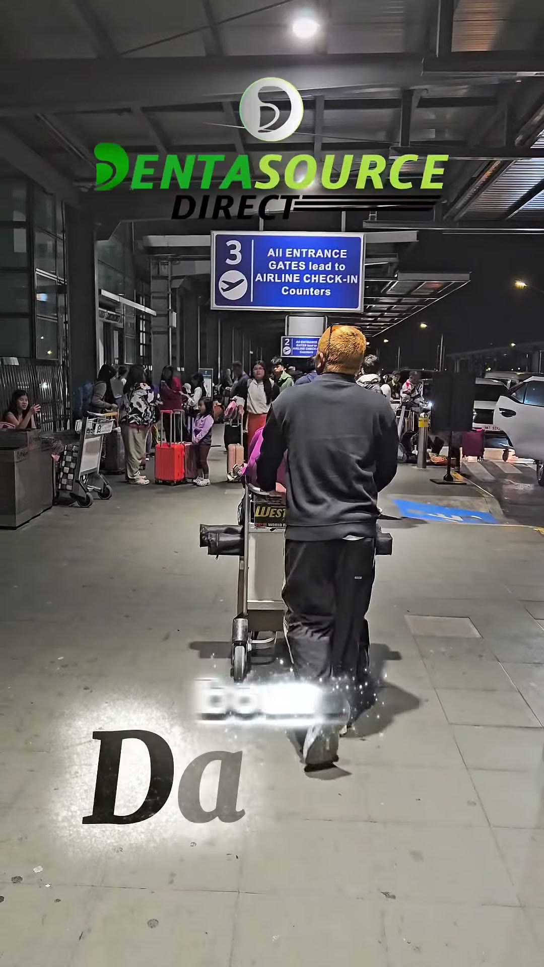 Our team pushing the equipment cart at the airport terminal