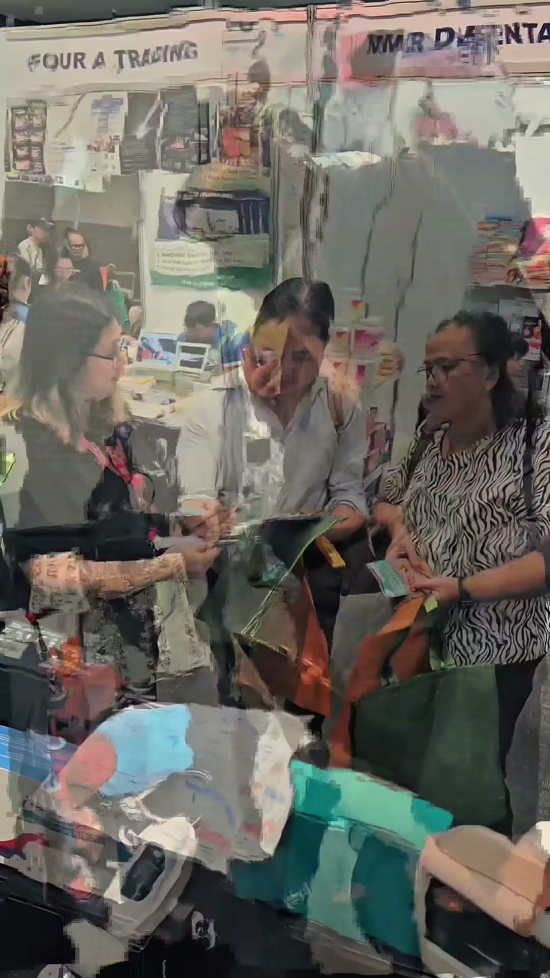 Visitors gathered at the booth counter on day two