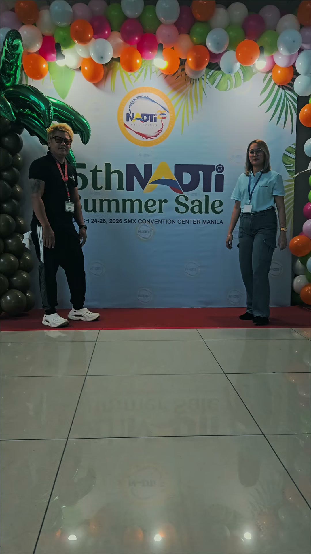 Under the 5th NADTI Summer Sale arch on opening day
