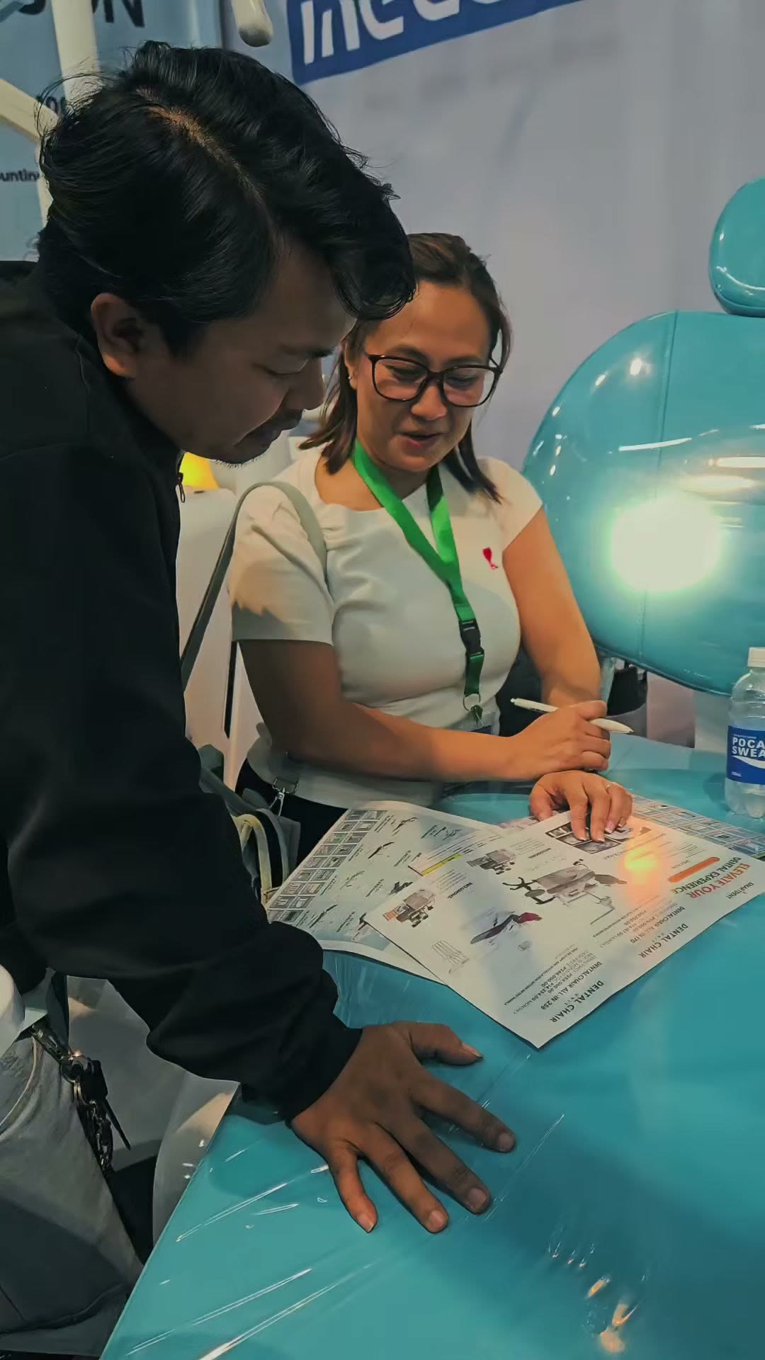 A dentist going through the product sheet