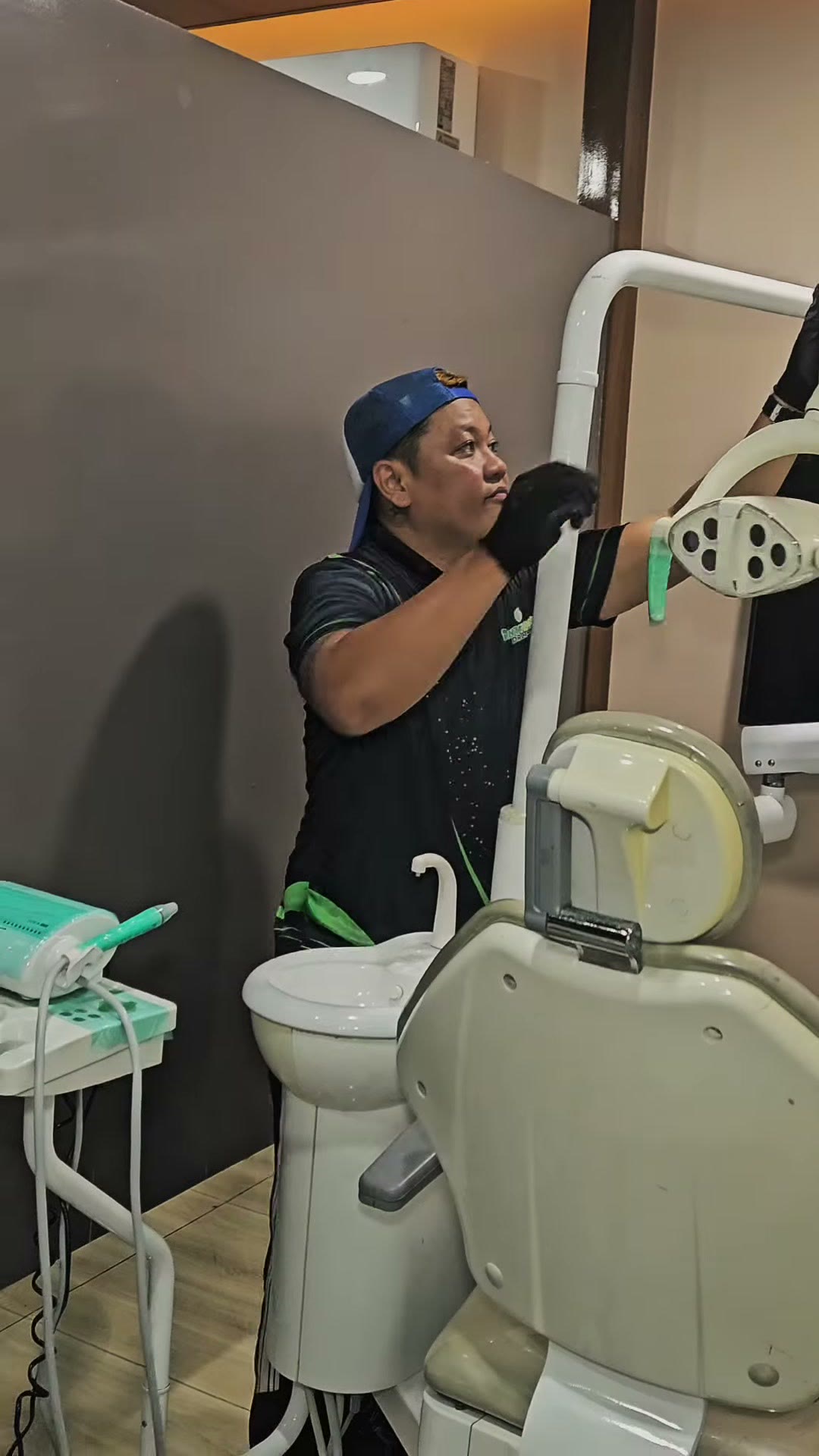 Our technician starting at the light arm of the old dental unit