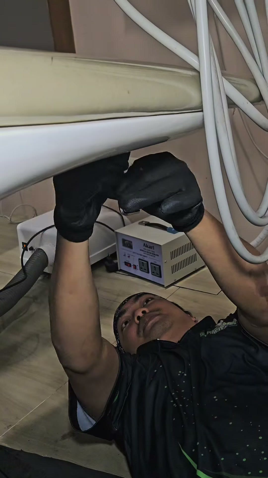 Unbolting the old light arm before lifting it clear
