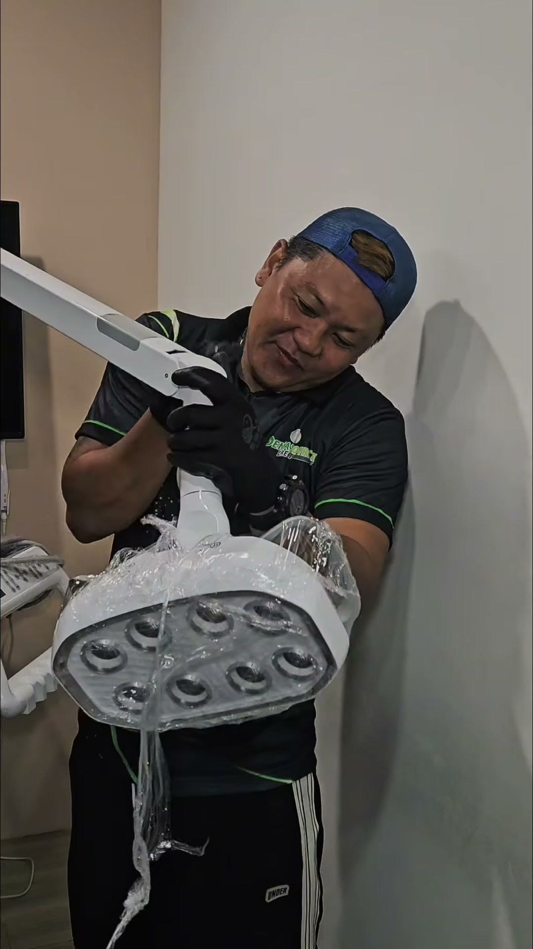 Our technician holding the LED operating light head before mounting