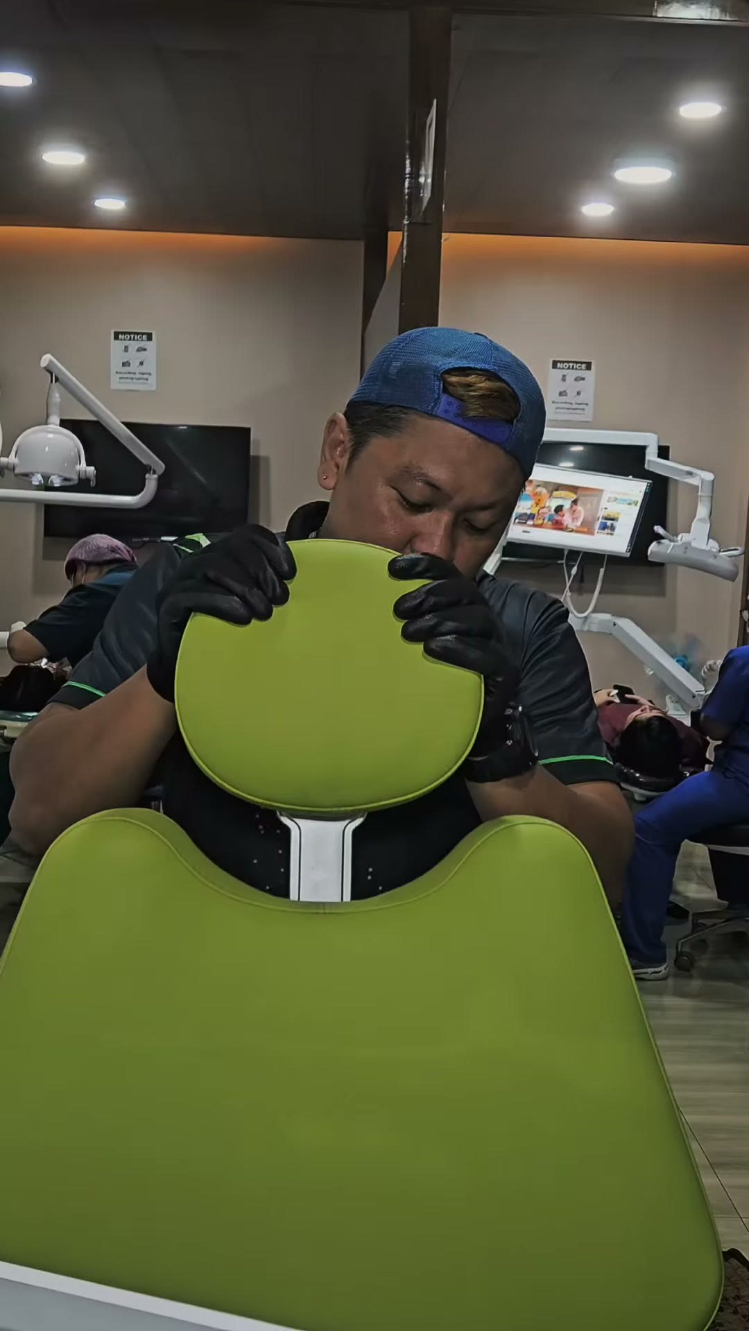 Placing the green upholstery cushion on the new chair
