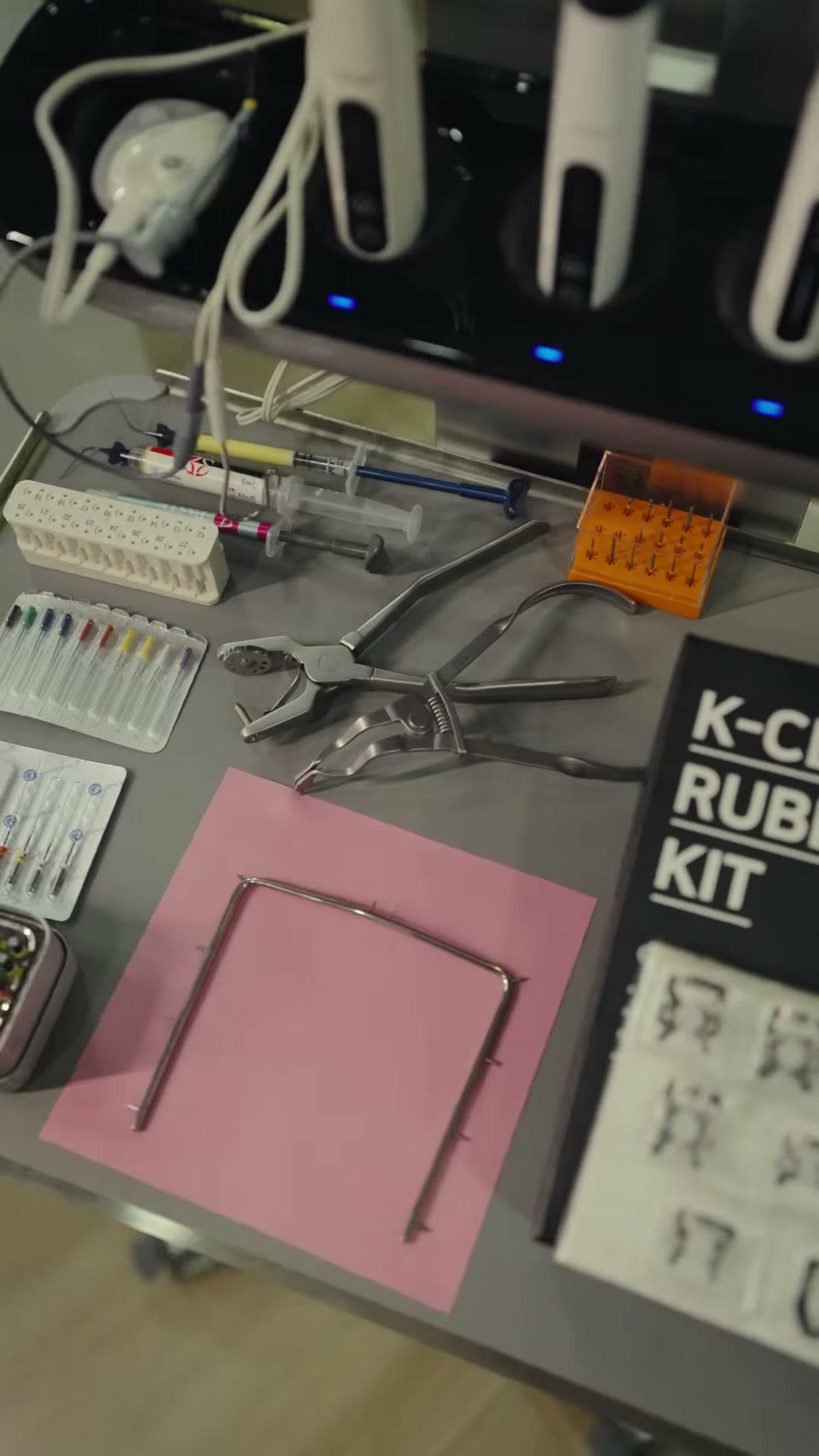 The instrument tray laid out with a rubber dam kit