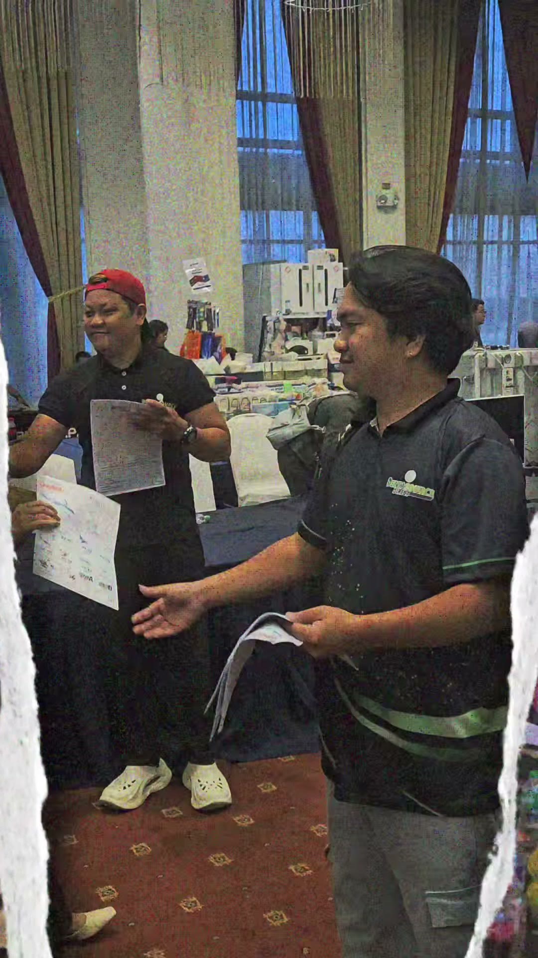 Two of our team on the ballroom floor during the seminar