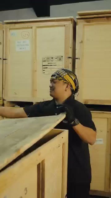 Prying the lid off the shipping crate
