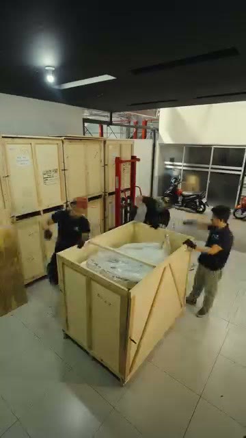 The opened crate resting on a pallet jack