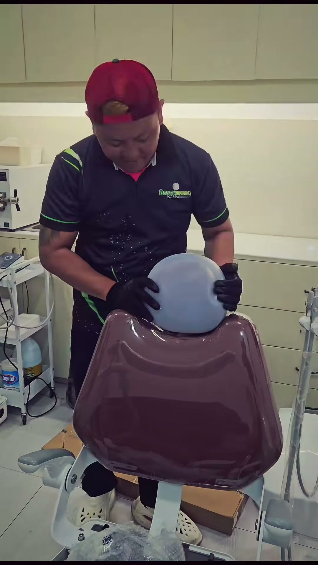 Fitting the burgundy backrest onto the DX-A3 chair