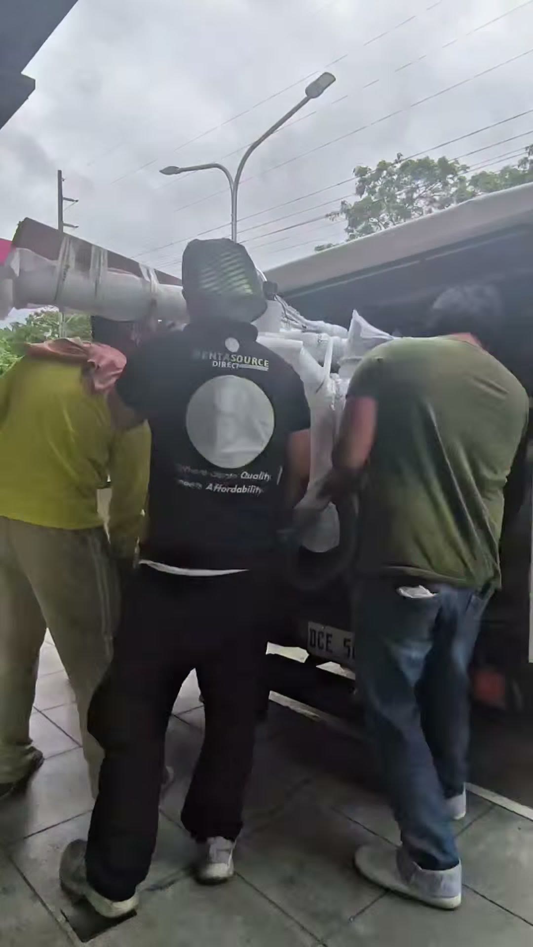 Unloading the wrapped dental unit from the truck