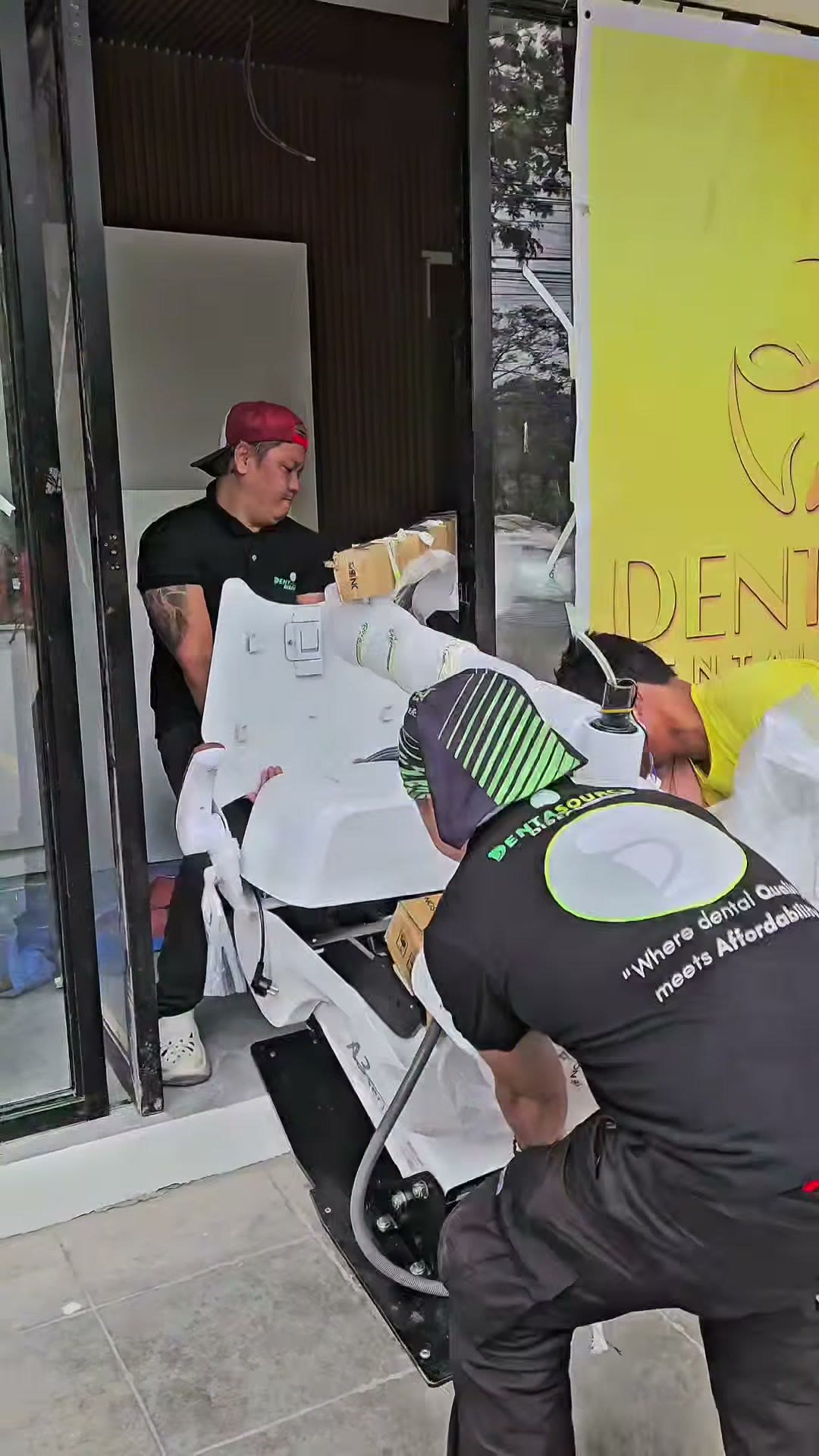 Our technician at the glass front of the clinic on arrival