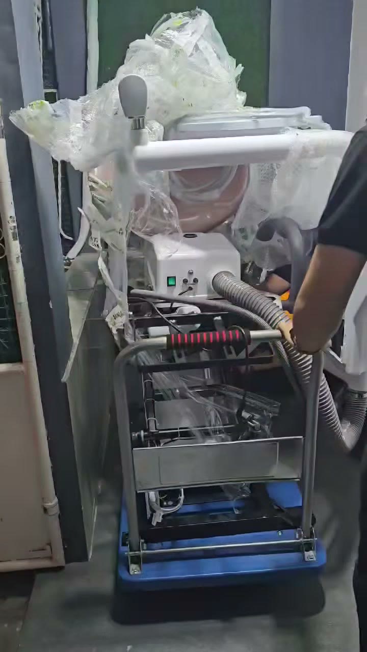 Wheeling the wrapped unit and compressor in on a dolly