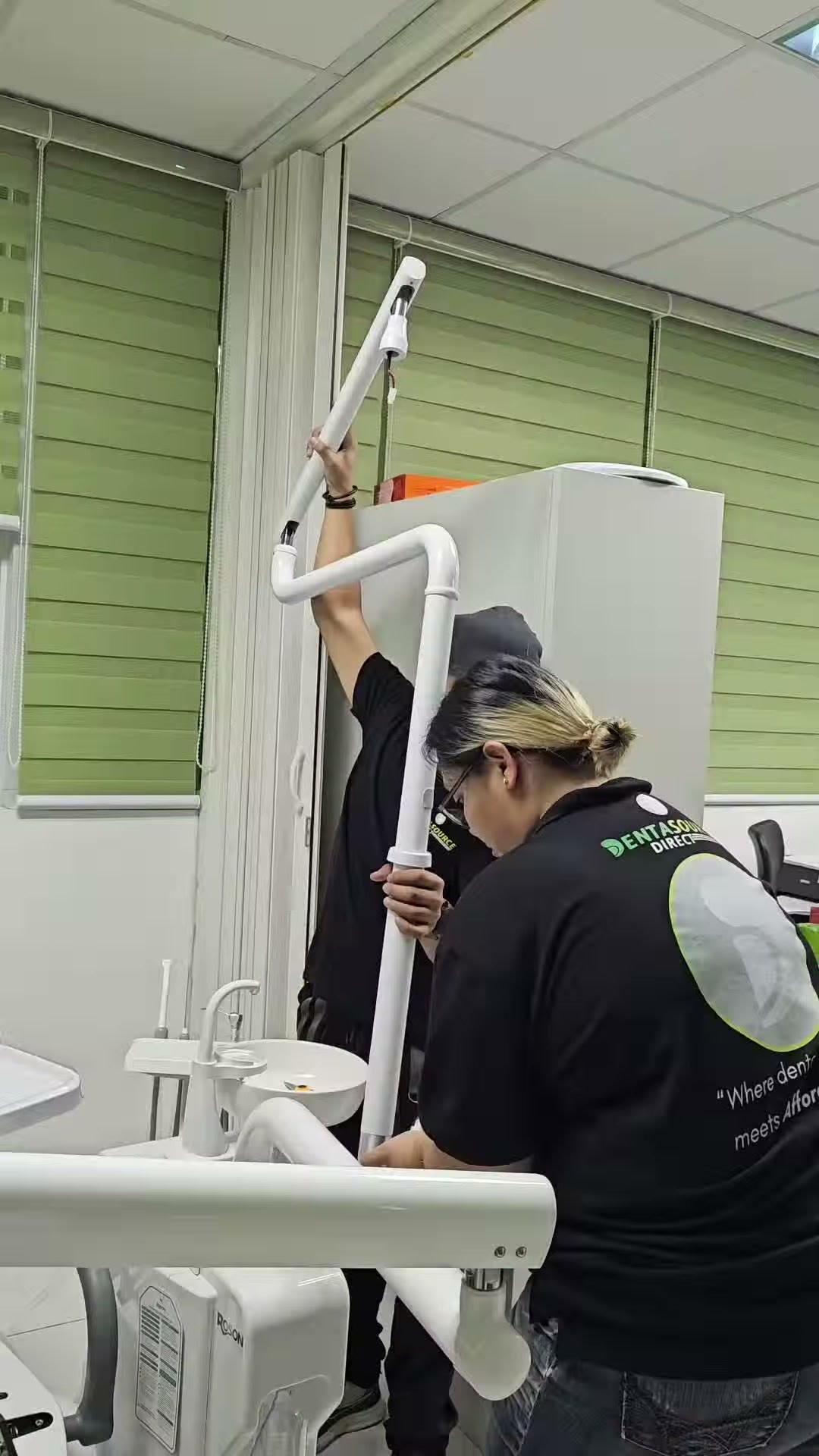 Our technicians raising the light post beside the new unit