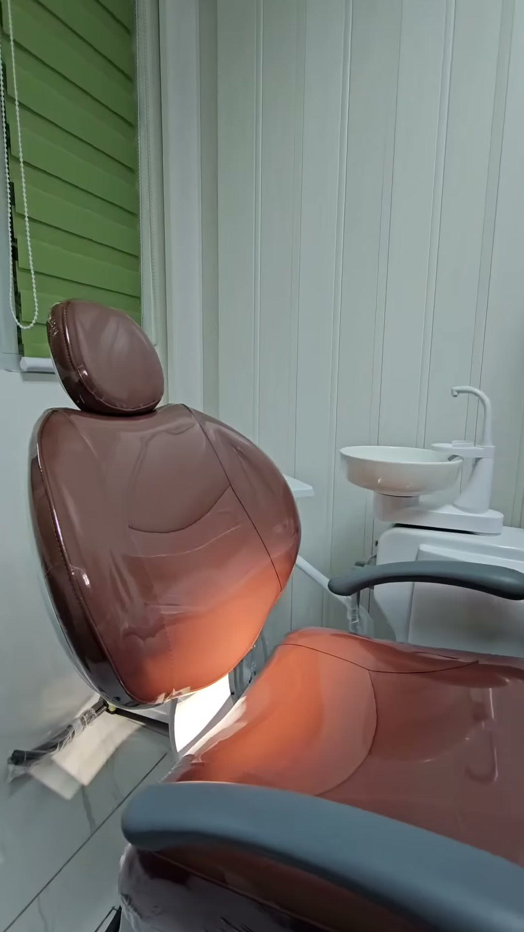 Close-up of the brown upholstery still in its protective film
