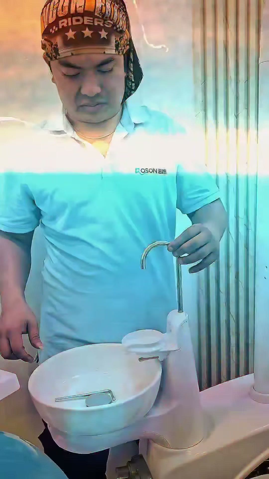 Our technician in a ROSON polo fitting the ceramic spittoon