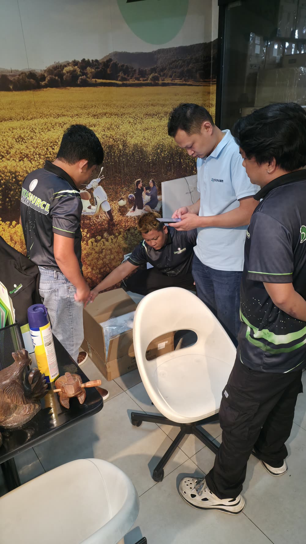 DentaSource technicians inspecting units during the training