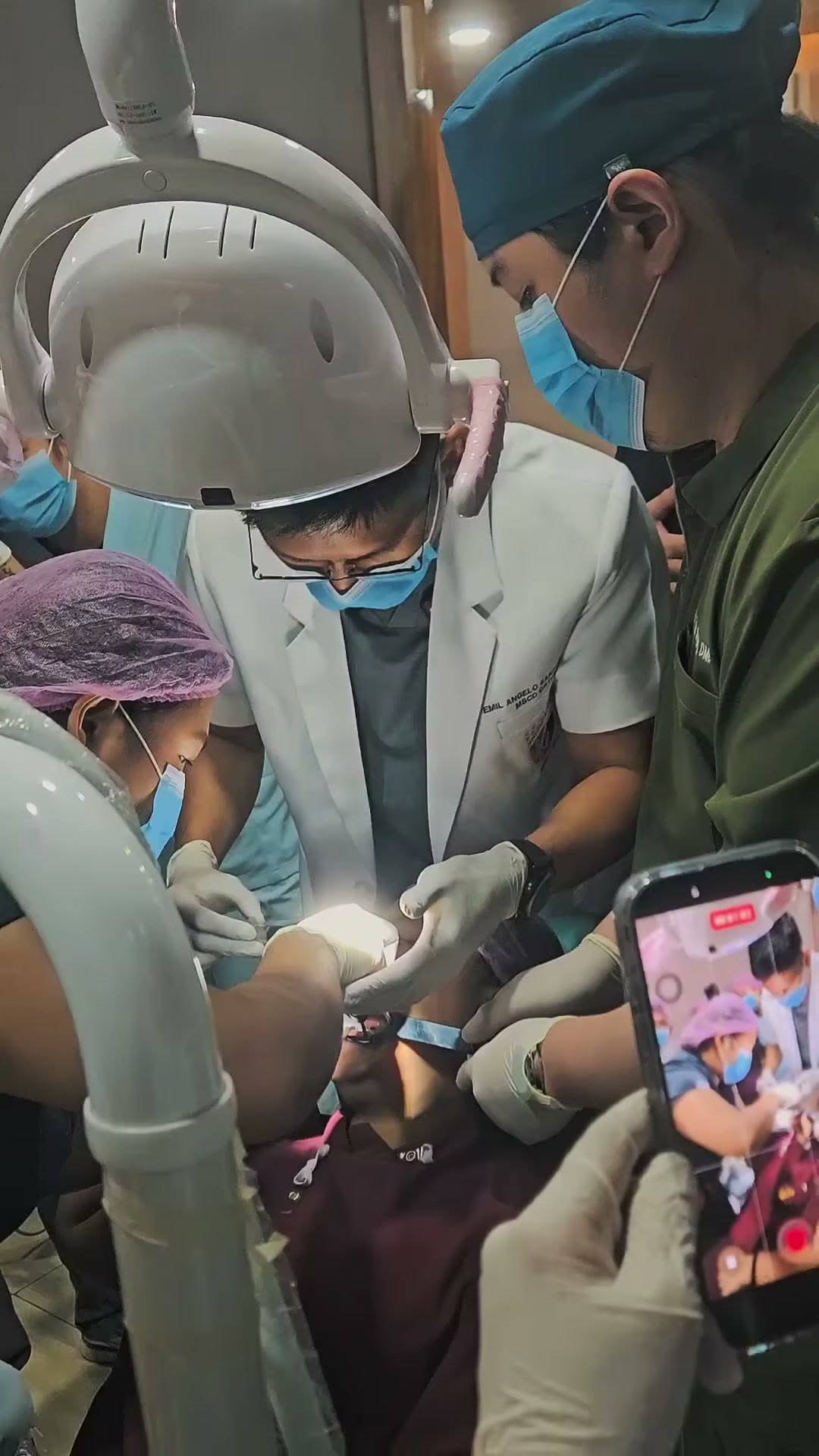 The operating light over the patient as a dentist works