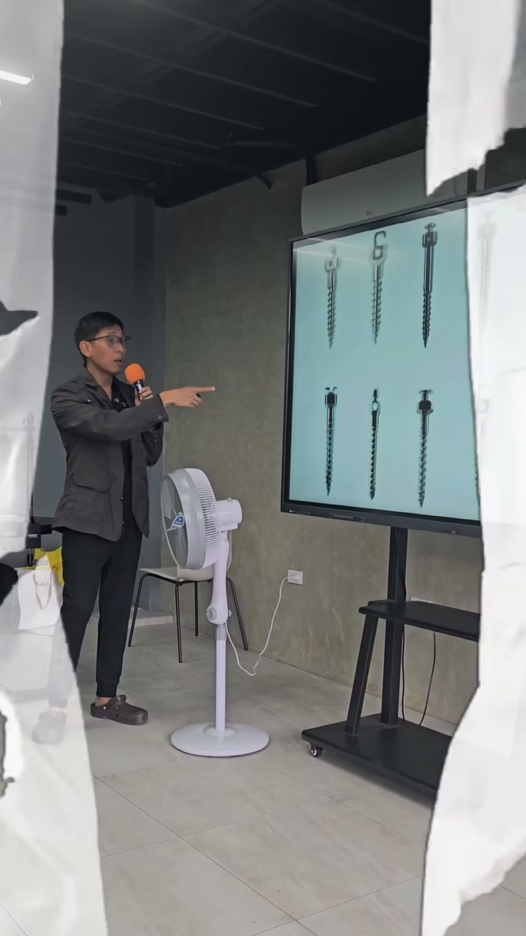 Dr. Emil Dayanghirang Santos presenting the mini-screw specification slide