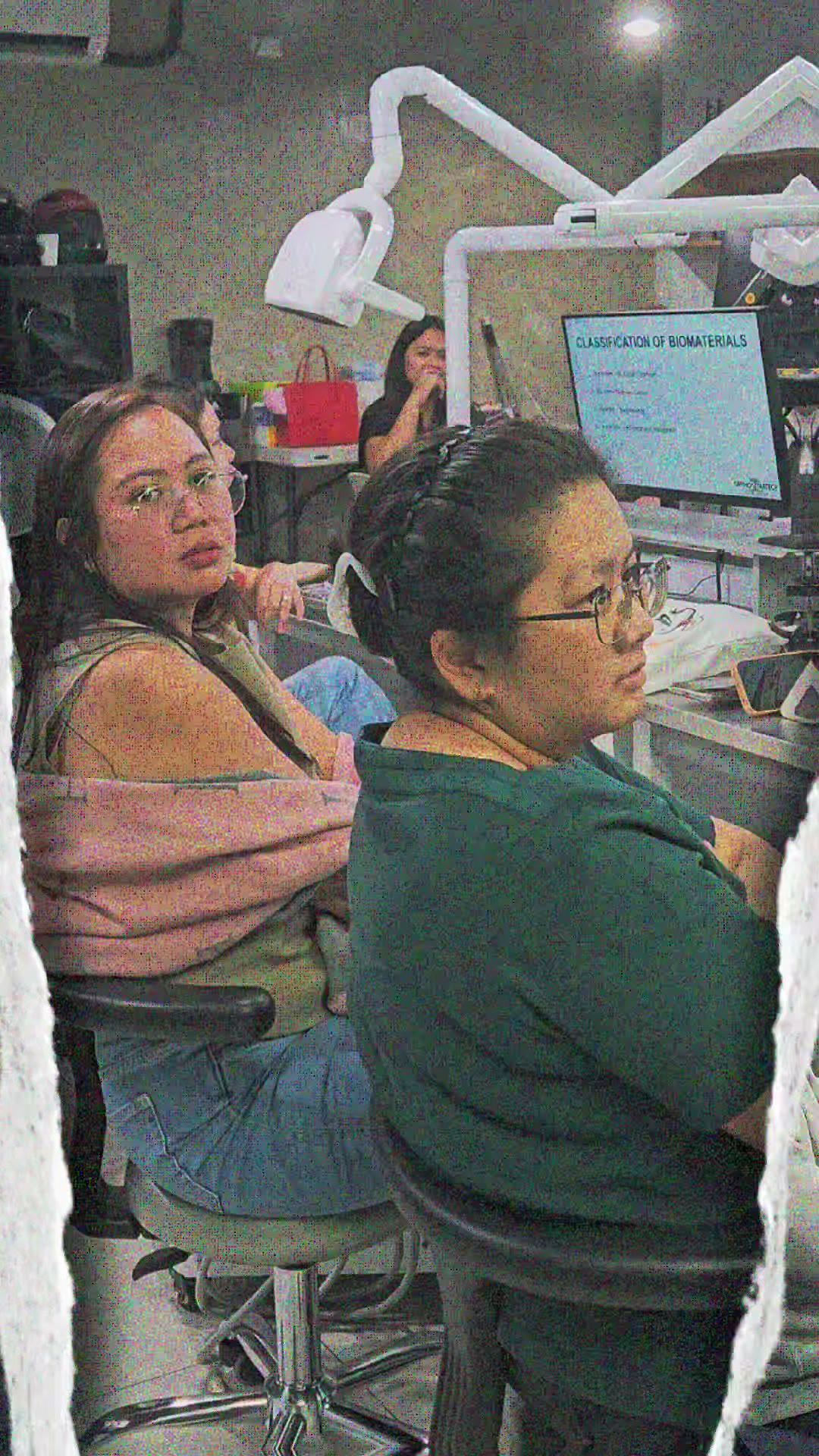 Participants listening at the row of simulator stations