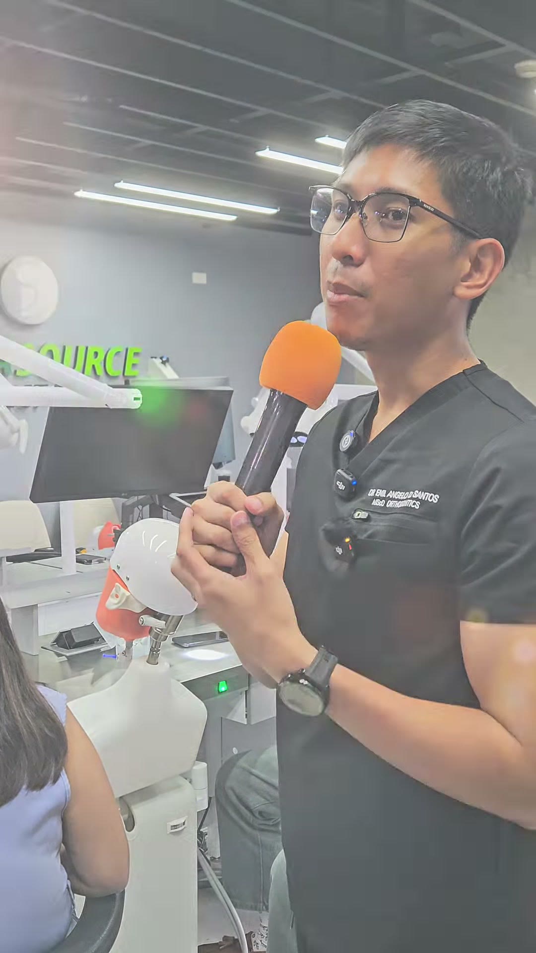 Dr. Emil answering a question at the microphone
