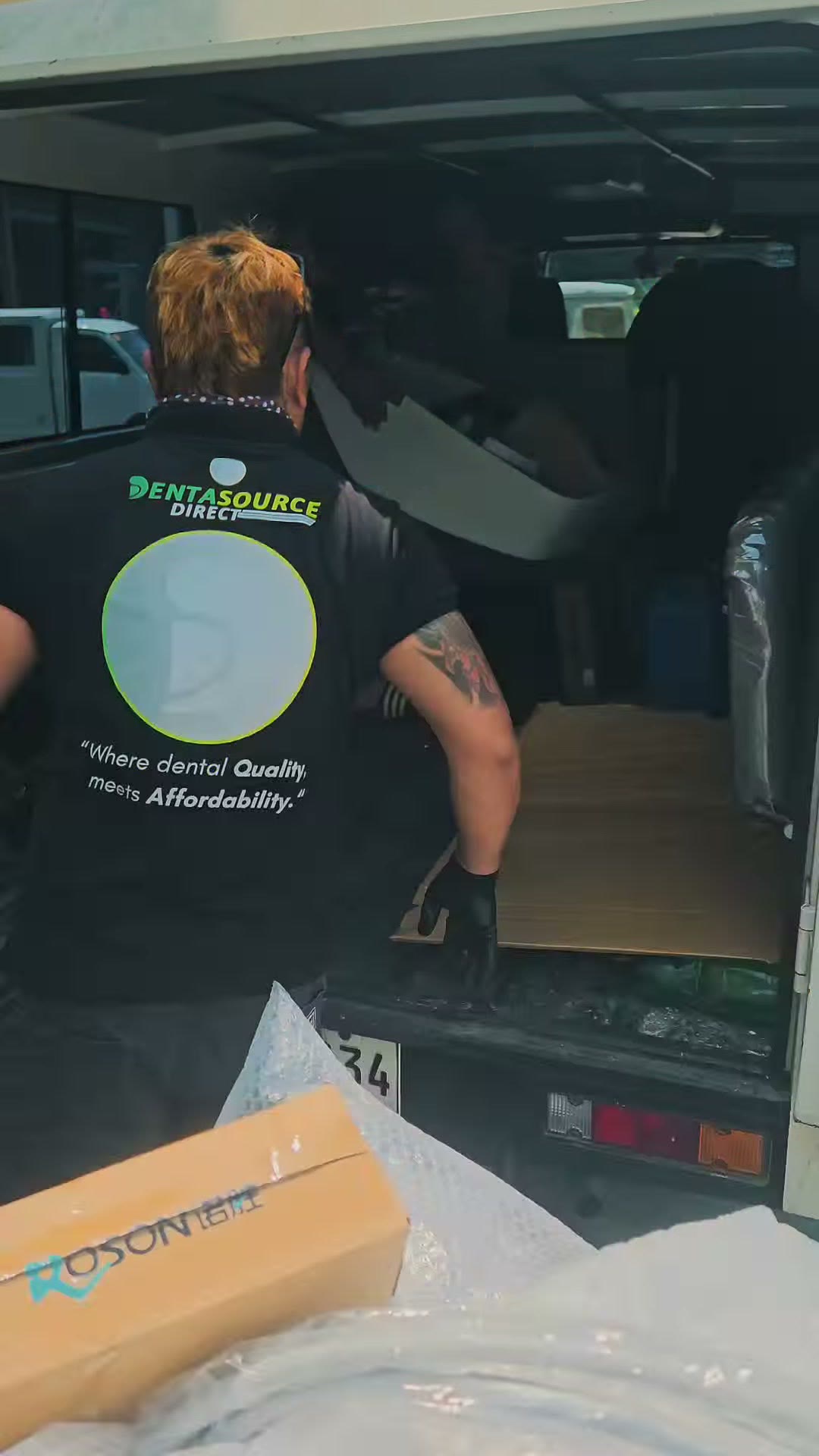 Unloading the ROSON carton from the delivery van