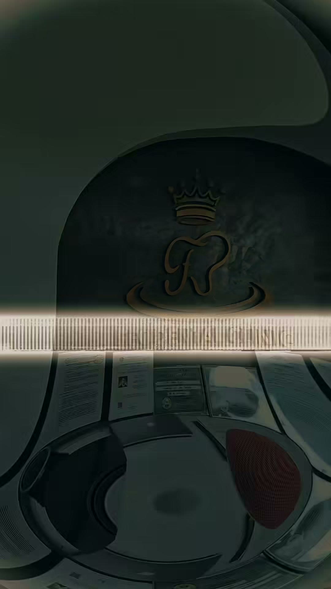 The clinic's crown and tooth logo at the entrance