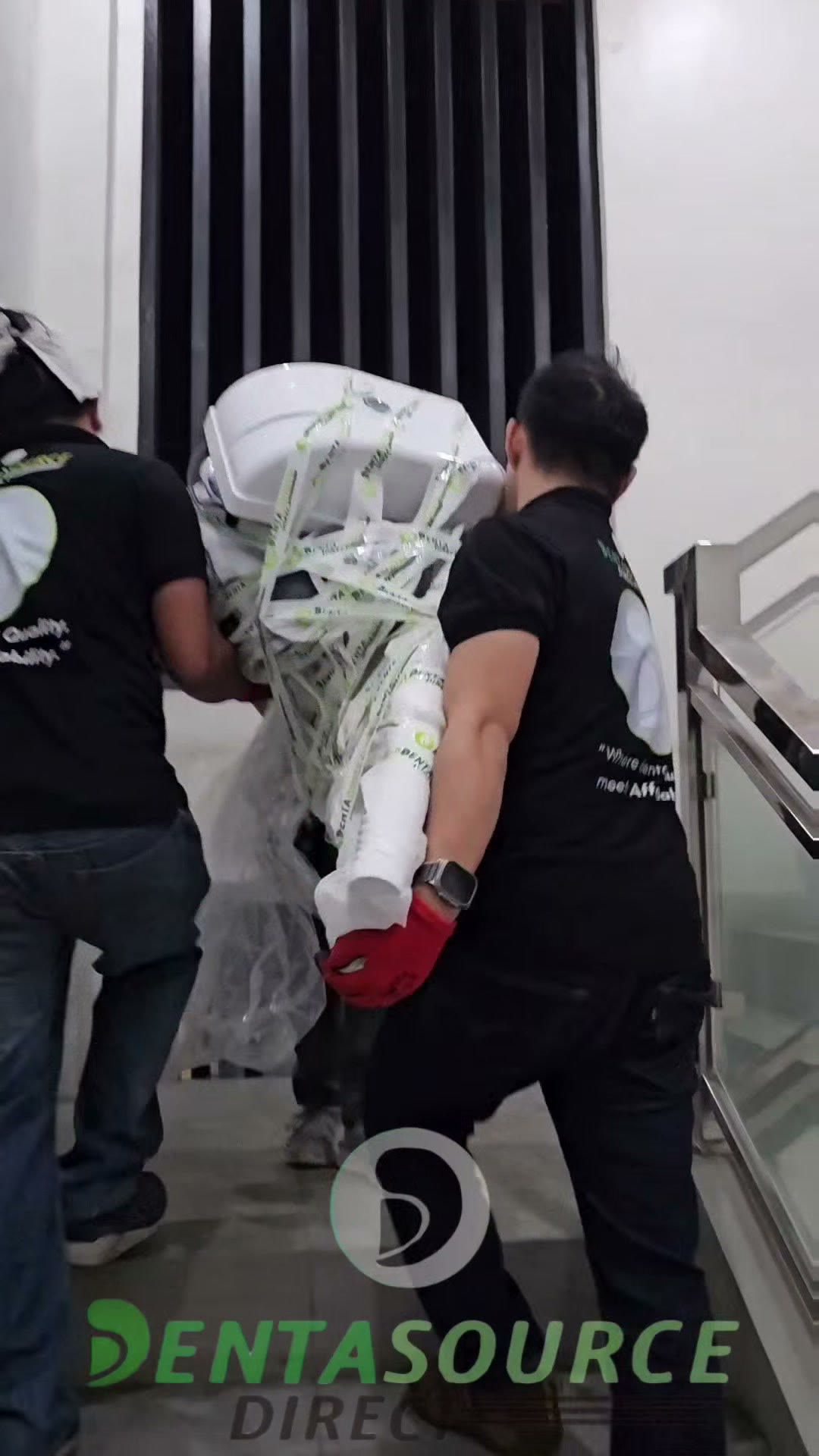Carrying a wrapped cuspidor and arm up the stairwell